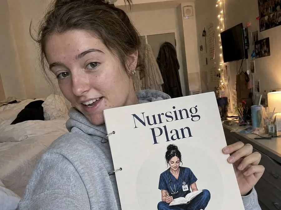 Maddie R. with her copy of the Nursing Plan
