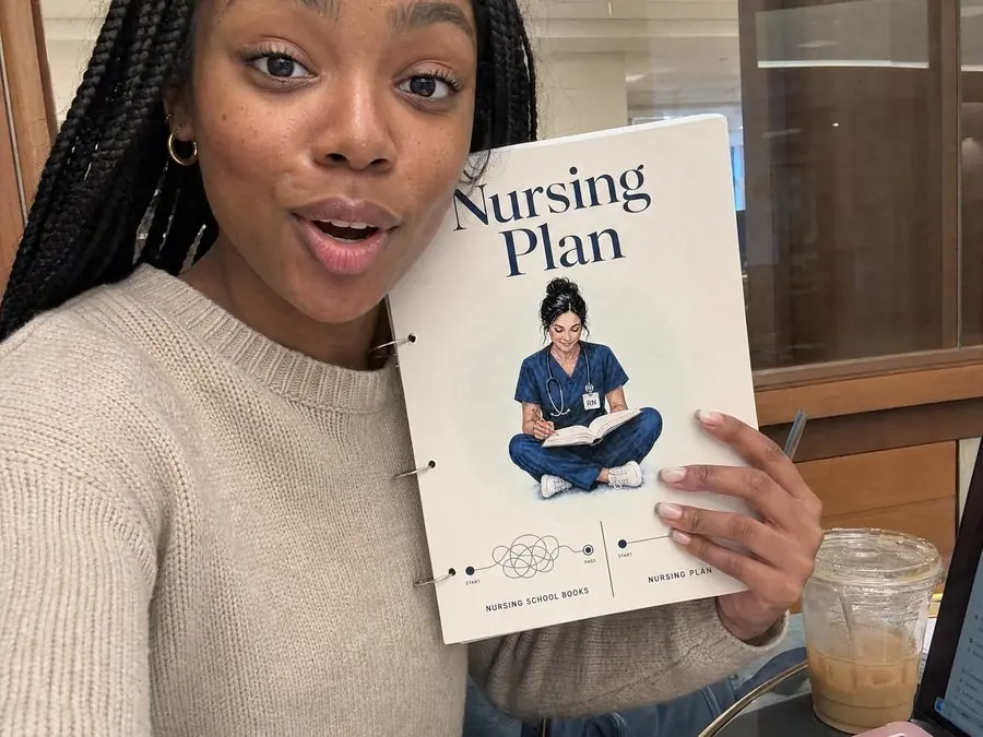 Amara T. with her copy of the Nursing Plan