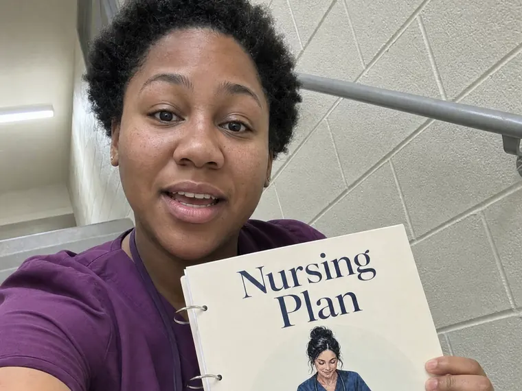 Tasha W. with her copy of the Nursing Plan